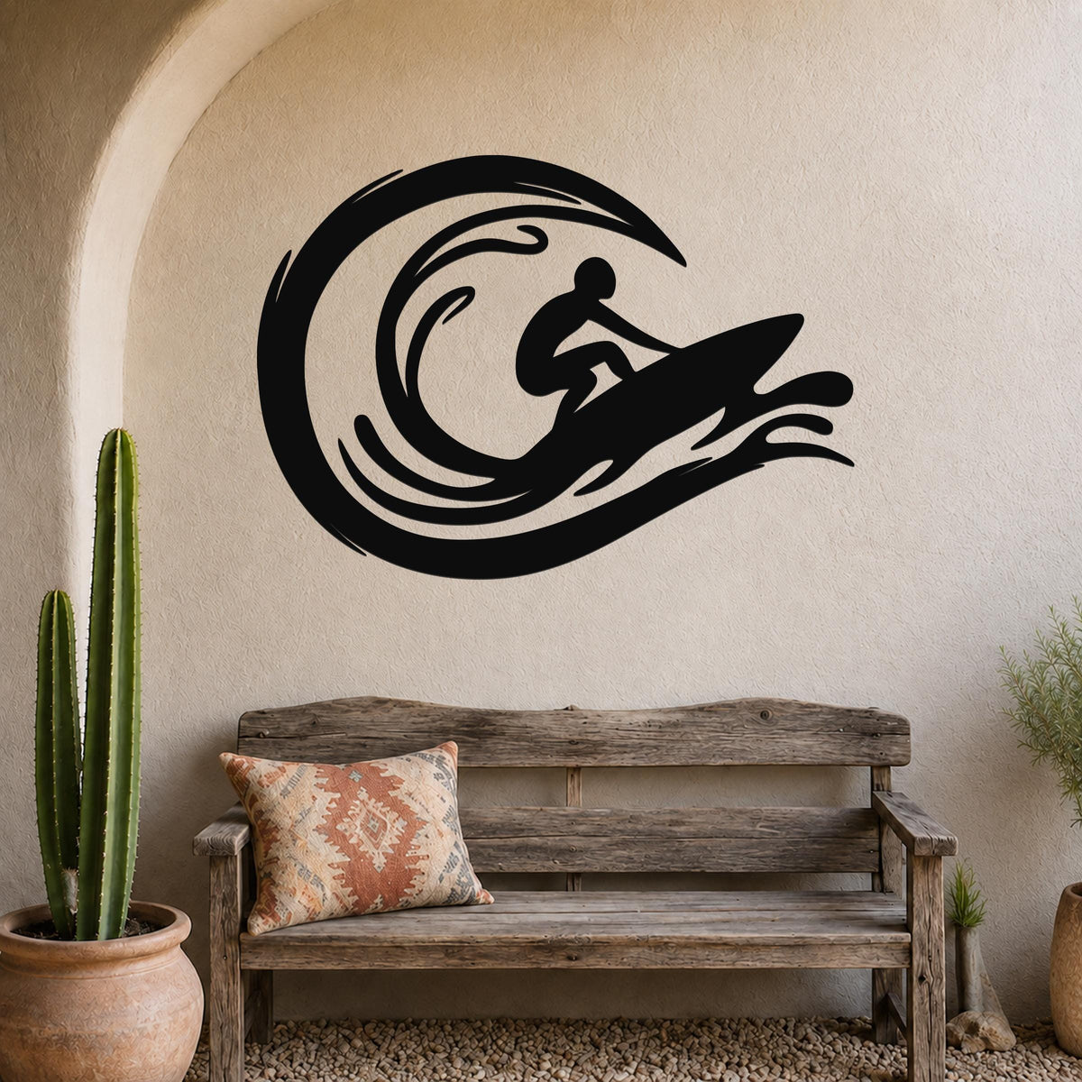 Black metal surfer wall art with wave cutouts, mounted above a wooden bench in a coastal-style entryway.