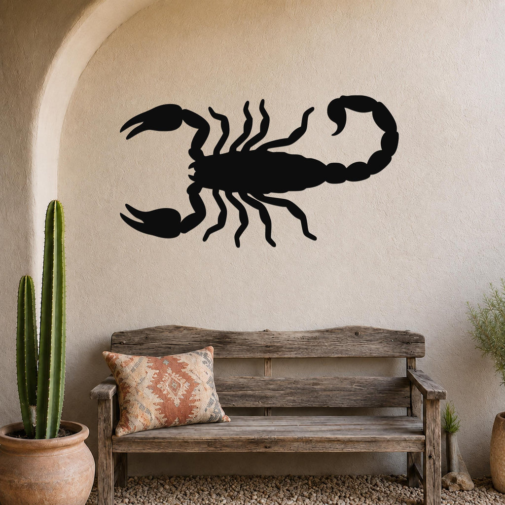 Black metal scorpion wall art silhouette mounted on a textured beige wall above a rustic wooden bench in a desert-themed entryway.