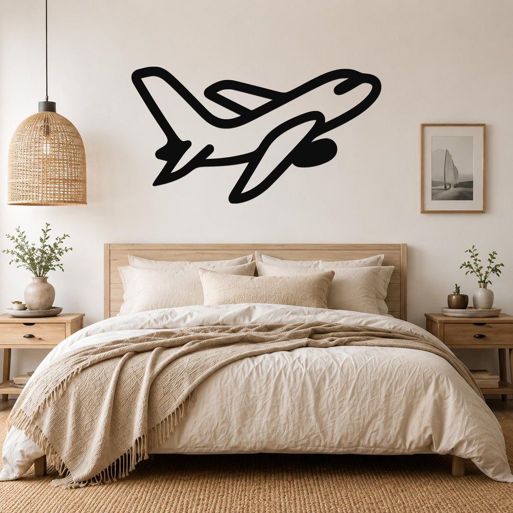 Black metal airplane wall art with a sleek silhouette design, mounted above a wooden bed in a neutral-toned bedroom.