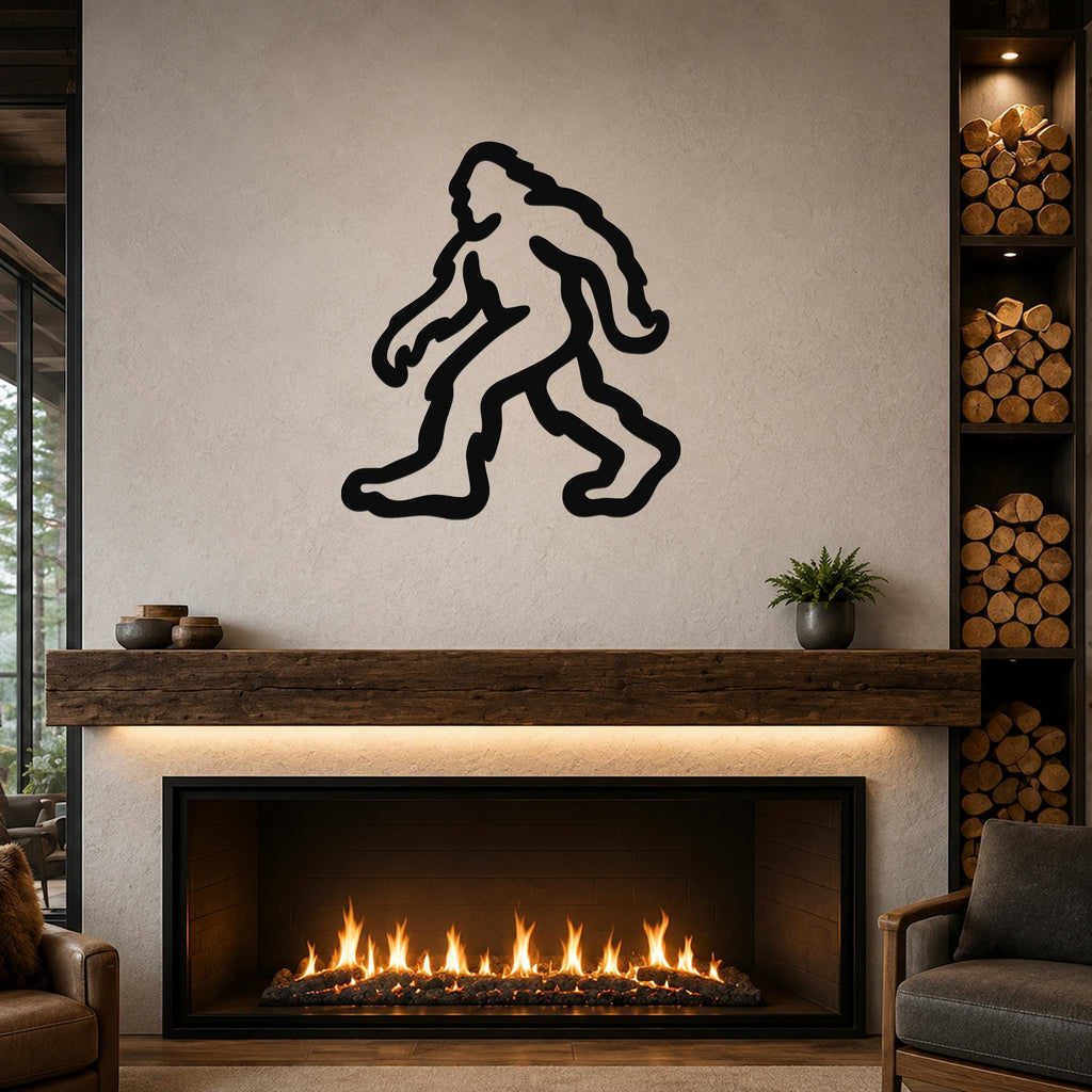 Black metal Bigfoot silhouette wall art mounted above a fireplace in a rustic living room.