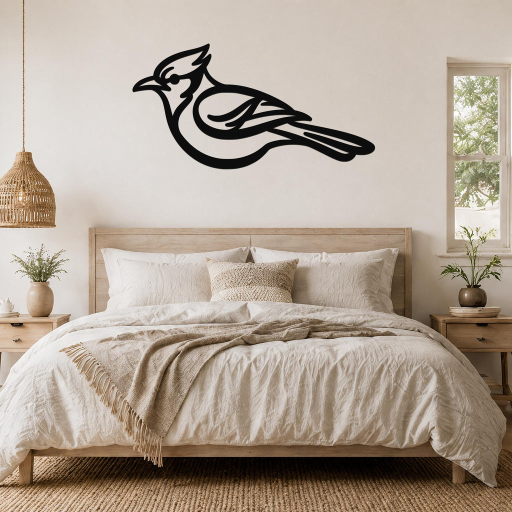 Black metal blue jay wall art silhouette mounted above a bed in a neutral bedroom.