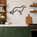Black metal Borzoi dog wall art silhouette mounted on a white tiled kitchen wall above a counter.