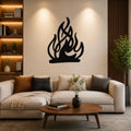 Black metal flame wall art with flowing silhouette cutouts, mounted on a living room wall above a beige sofa.