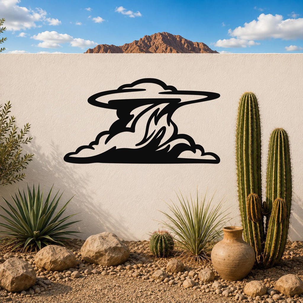 Black metal cloud wall art with flowing silhouette cutouts, mounted on a white outdoor wall above a desert garden with cacti and rocks.