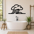 Black metal wall art in a cloud and wave silhouette design, mounted on a bathroom wall above a freestanding tub.