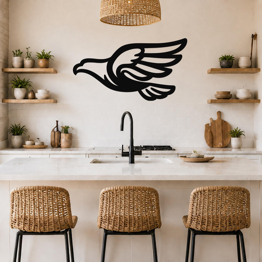 Black metal eagle wall art with a bold silhouette and wing cutouts, mounted on a kitchen wall above a counter.