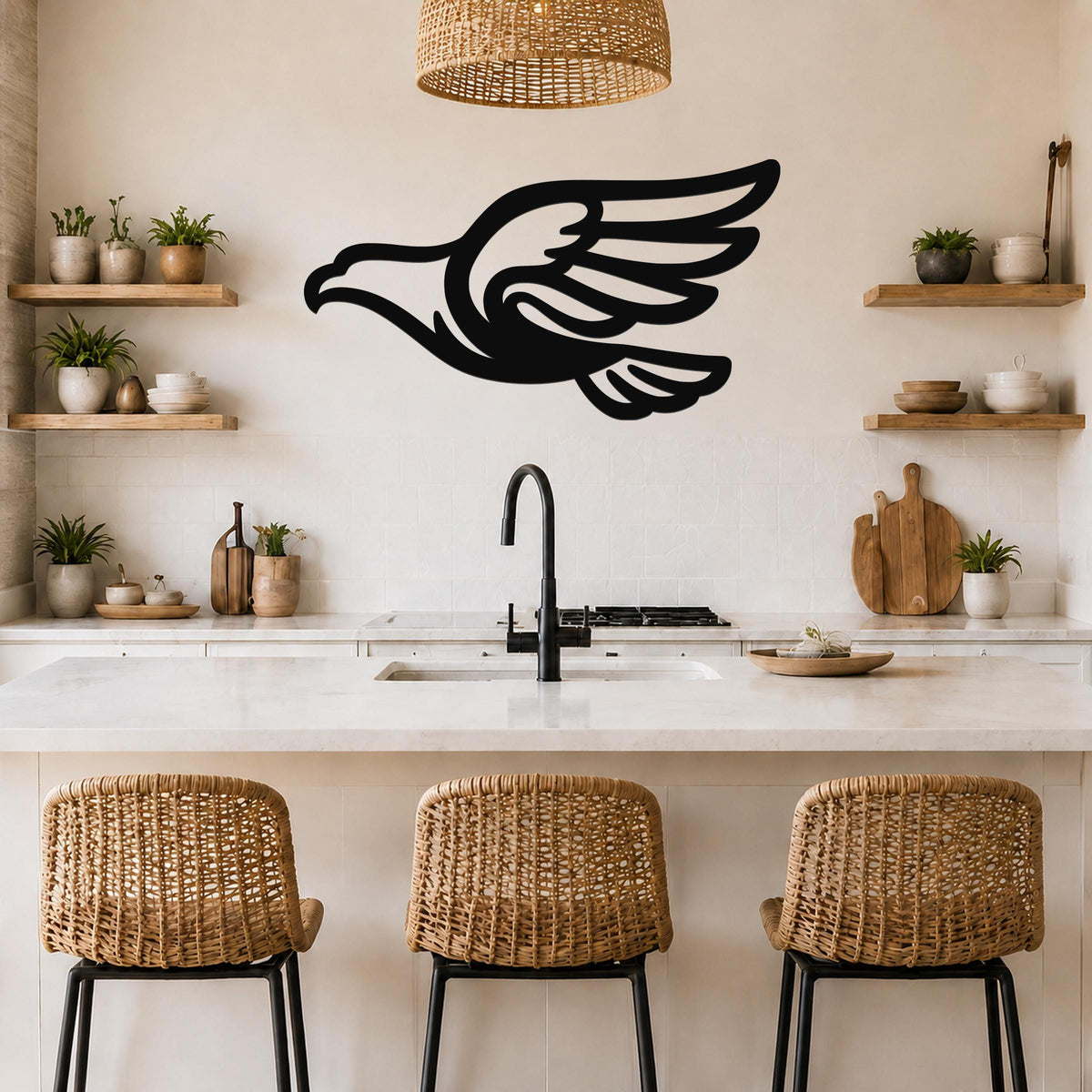 Black metal eagle wall art with a bold silhouette and wing cutouts, mounted on a kitchen wall above a counter.