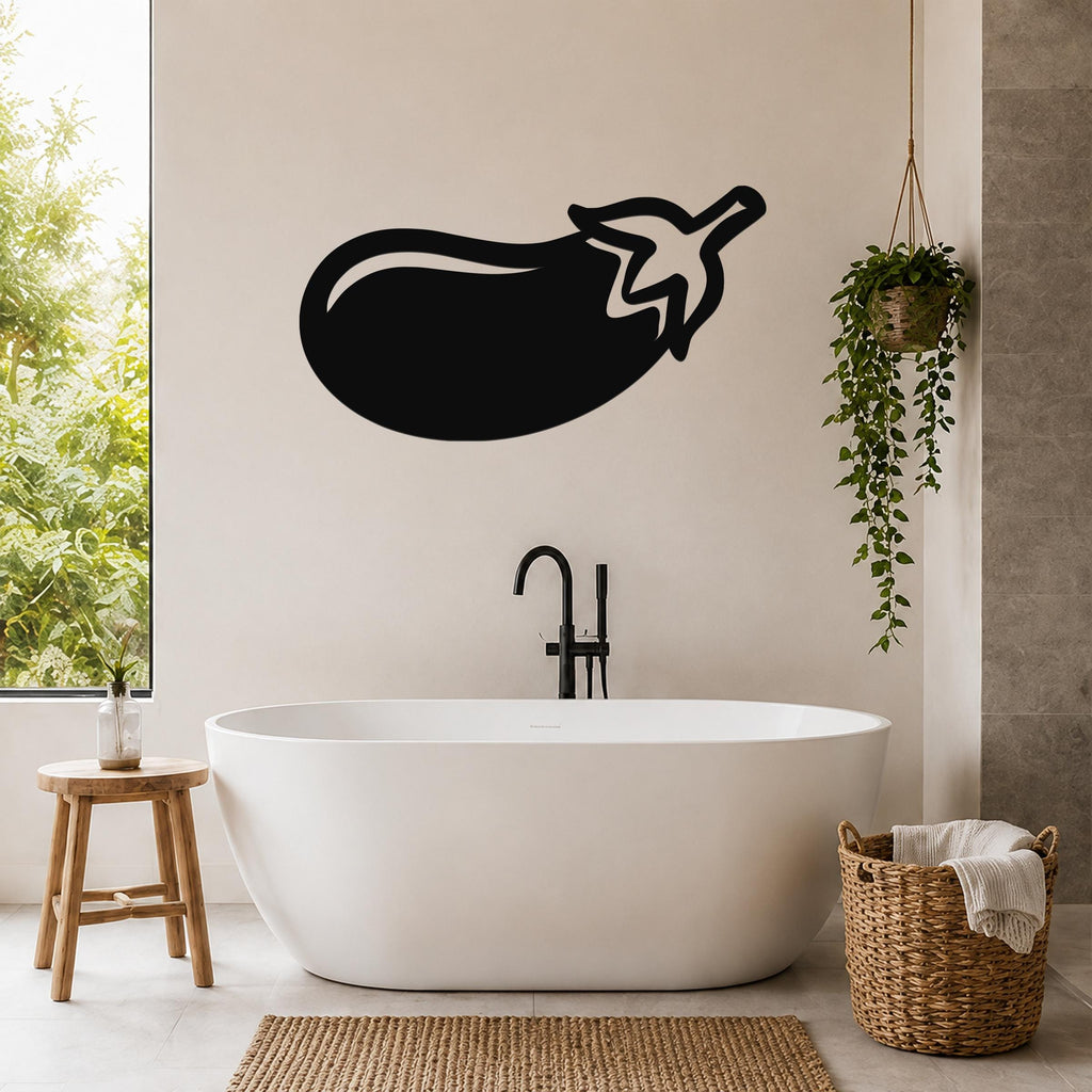 Black metal eggplant wall art silhouette mounted on a bathroom wall above a freestanding tub.