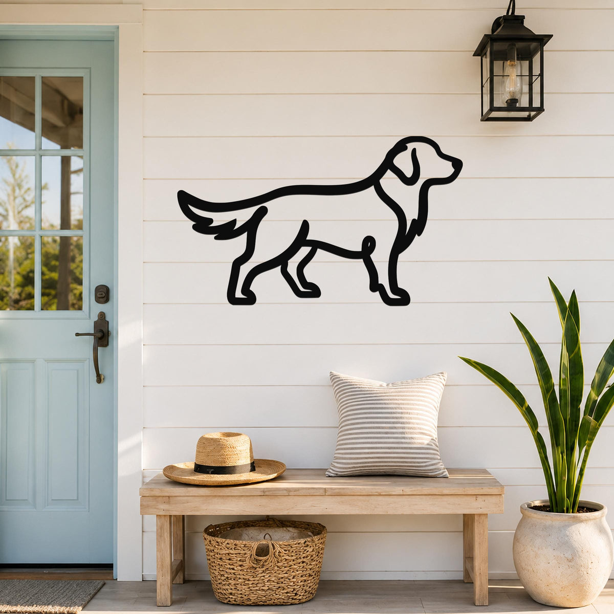 Black metal dog silhouette wall art mounted on a white shiplap wall above a wooden bench in a front entryway.