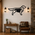 Black metal dog silhouette wall art with internal cutout details, mounted on a shiplap wall above a wooden console table in a living room.