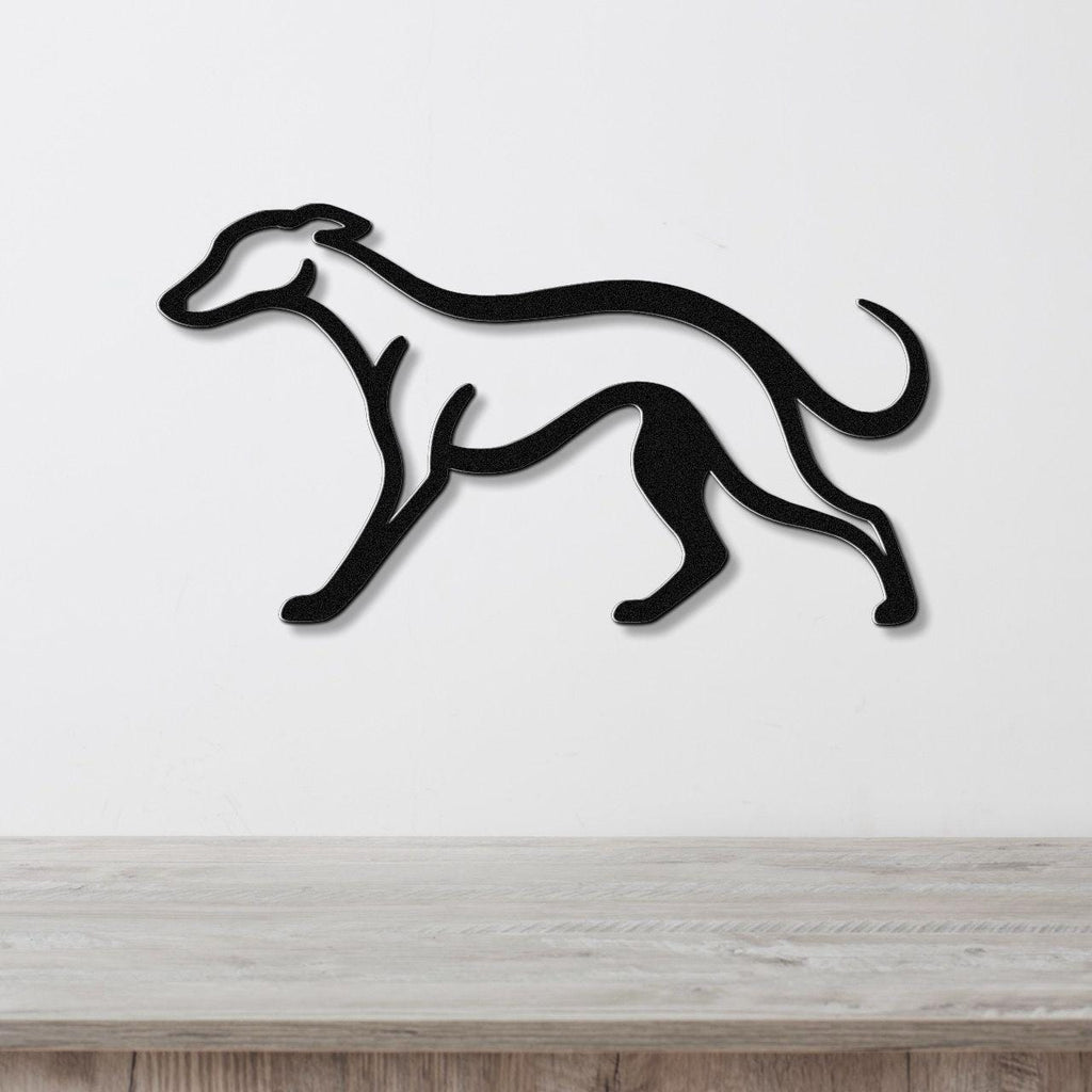 Black metal greyhound wall art with a sleek silhouette, mounted on a white wall above a light wood surface.