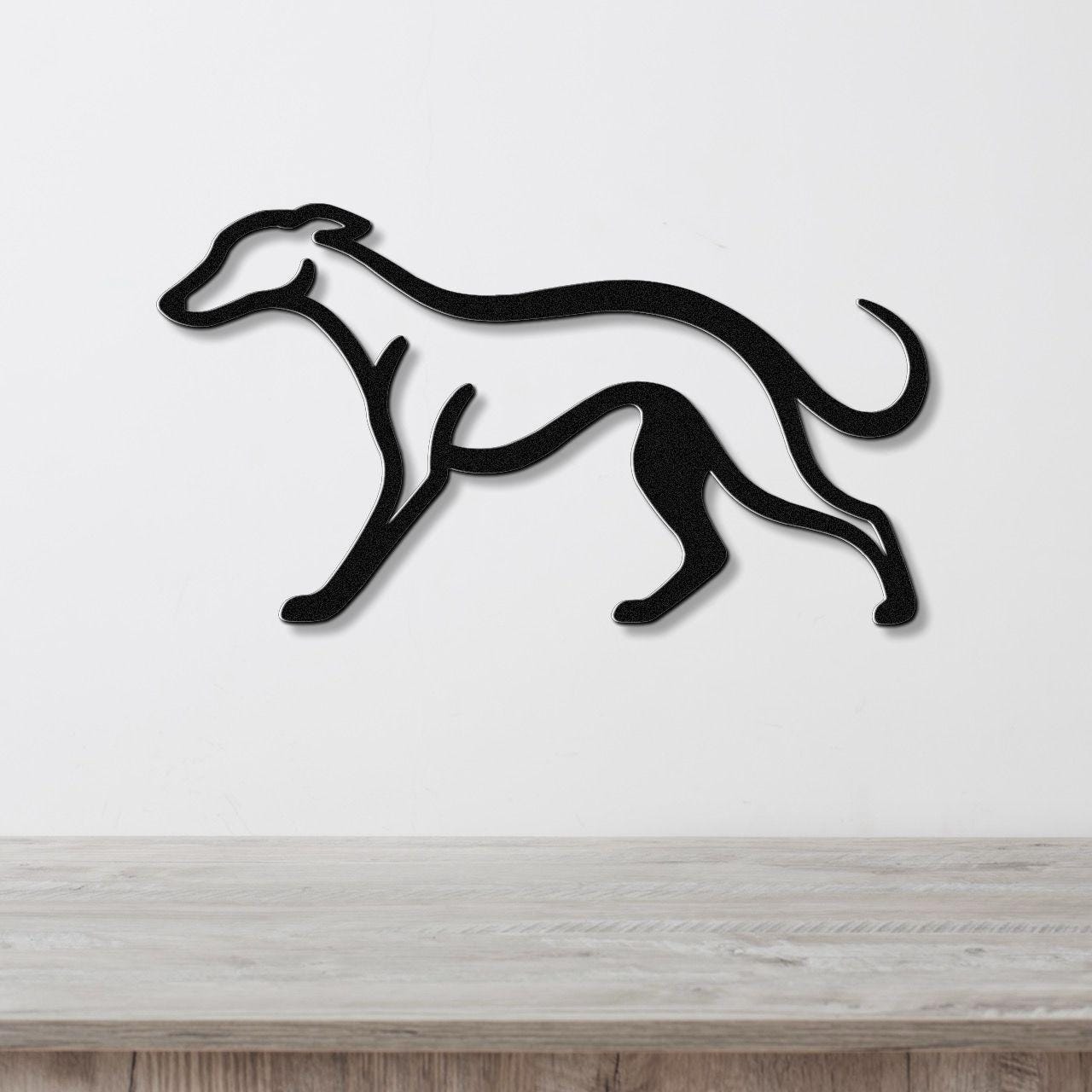 Black metal greyhound wall art with a sleek silhouette, mounted on a white wall above a light wood surface.