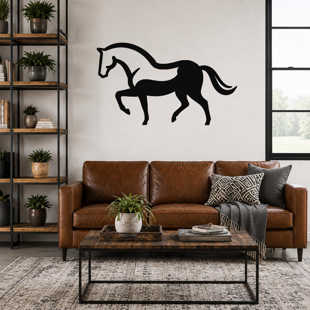 Black metal horse wall art silhouette with flowing mane and tail, mounted above a brown leather sofa in a living room.