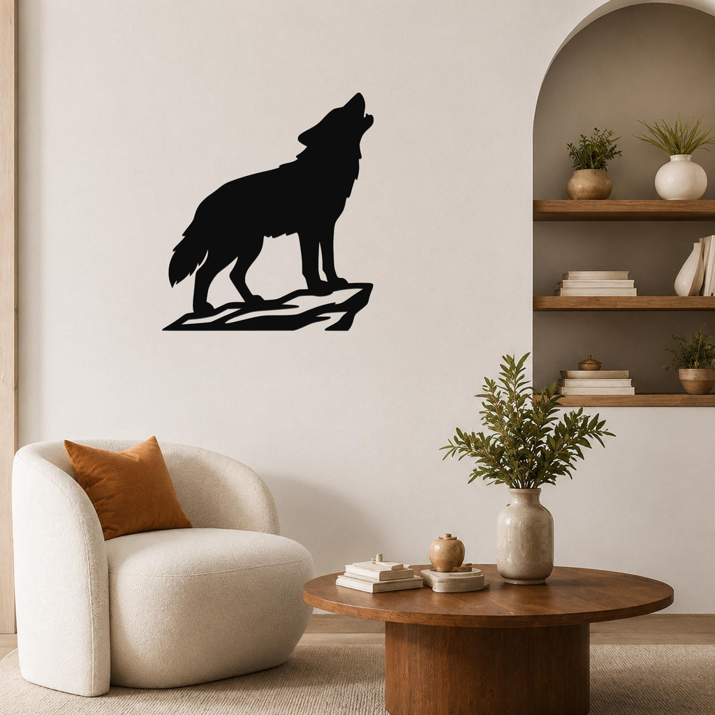 Black metal coyote wall art silhouette howling on a rock, mounted on a living room wall above a white armchair.