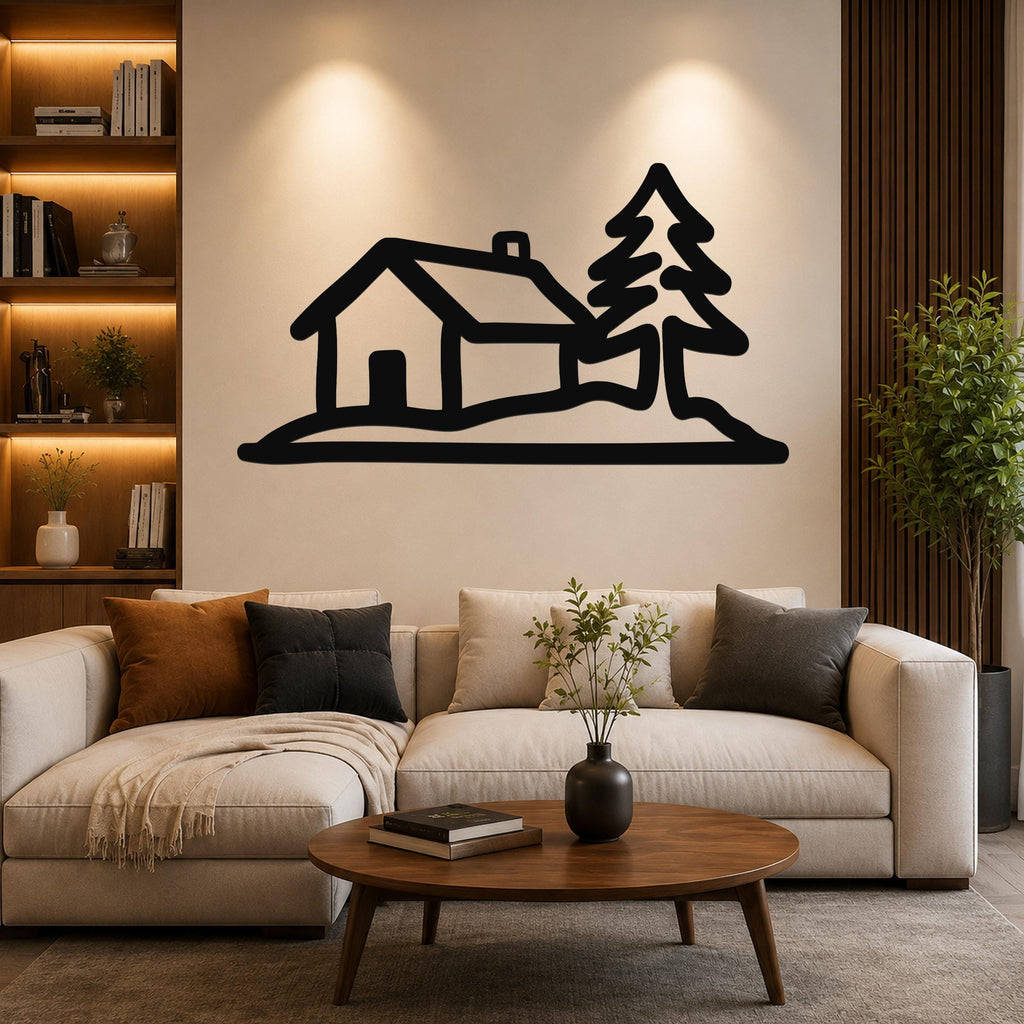 Black metal wall art silhouette of a cabin and pine tree, mounted above a sofa in a living room.