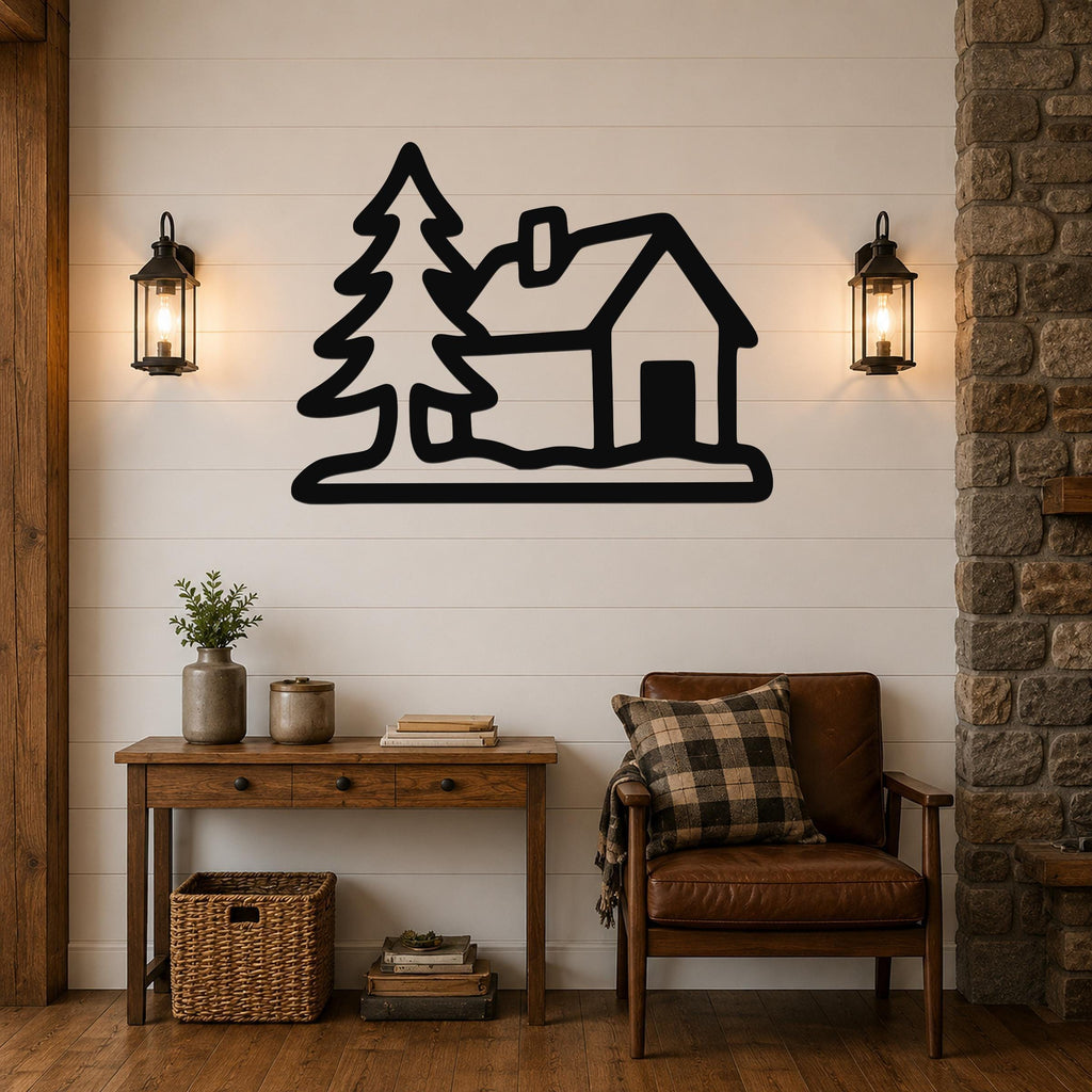 Black metal wall art silhouette of a cabin and pine tree, mounted on a shiplap wall above a wooden console table in a rustic living room.
