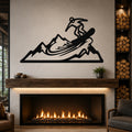 Black metal wall art with a snowboarder silhouette above a mountain range, mounted above a fireplace in a living room.