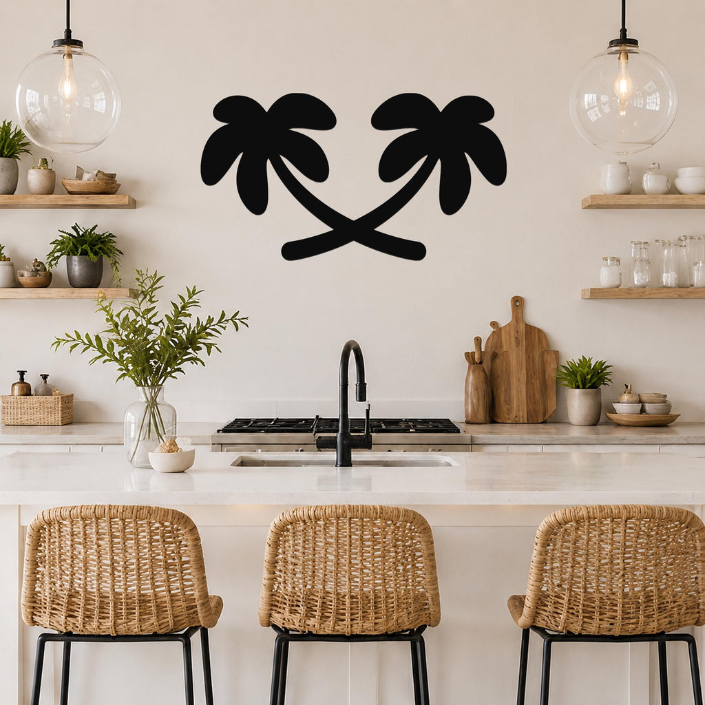 Black metal palm tree wall art with two silhouetted trees, mounted on a kitchen wall above a counter.