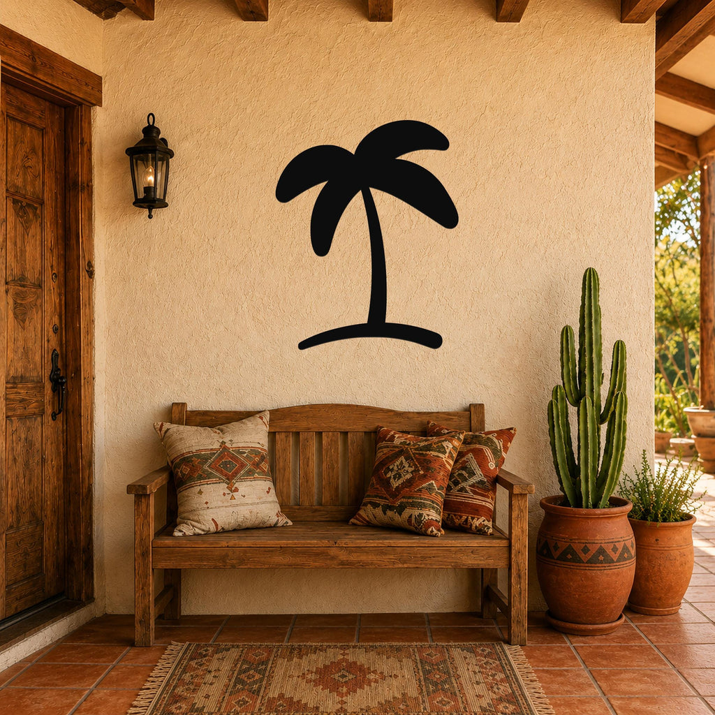 Black metal palm tree wall art silhouette mounted on a stucco wall above a wooden bench in a patio entryway.