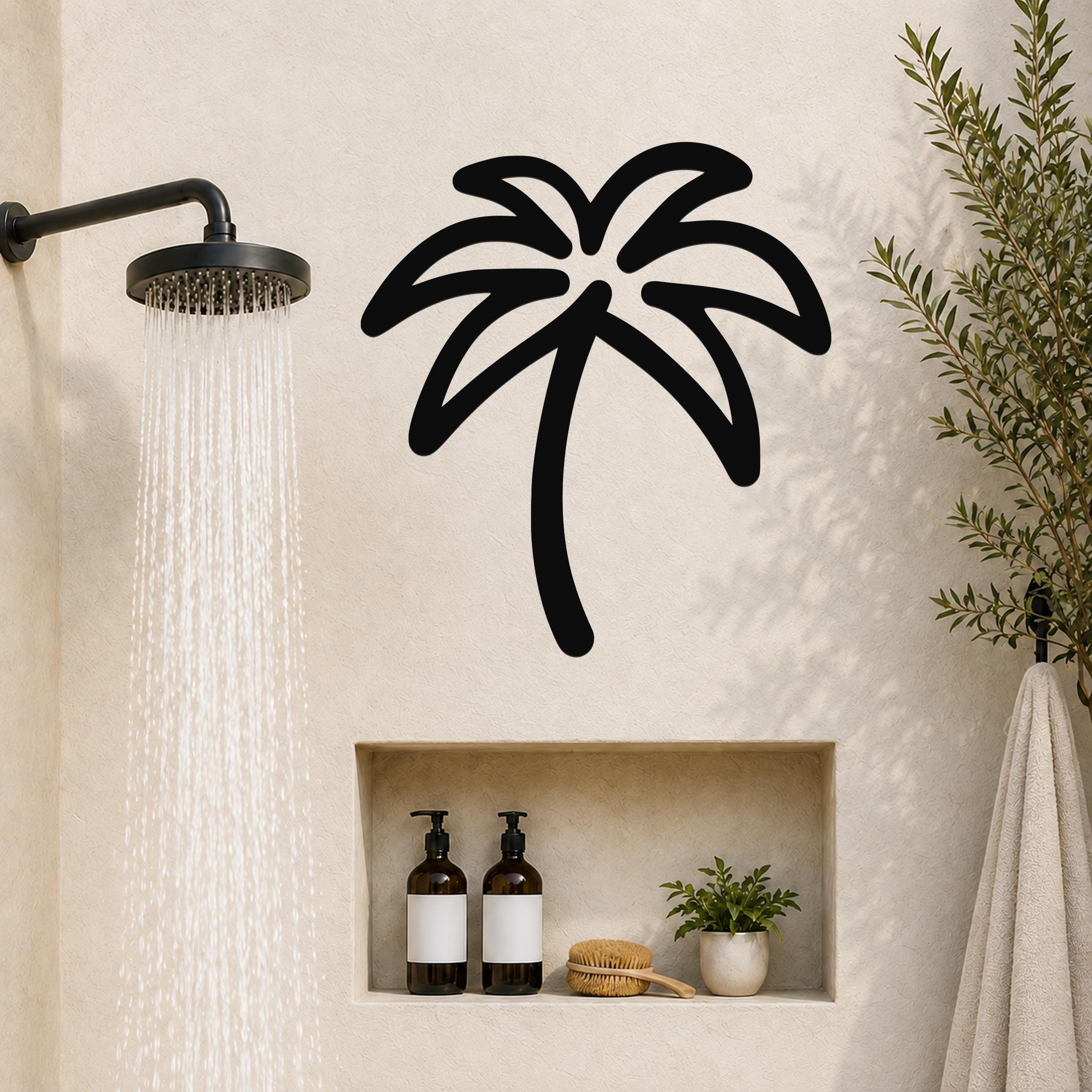 Black metal palm tree wall art with a silhouette design, mounted on a bathroom wall above a built-in shelf.