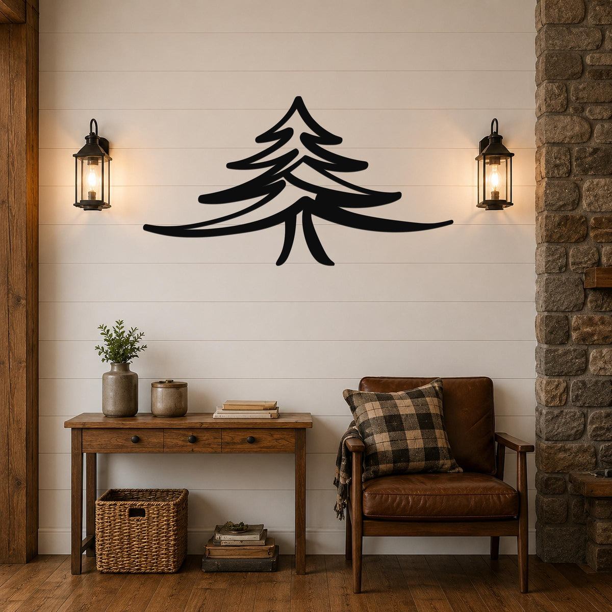 Black metal pine tree wall art with layered branch cutouts, mounted on a shiplap wall above a wooden console table in a rustic living room.
