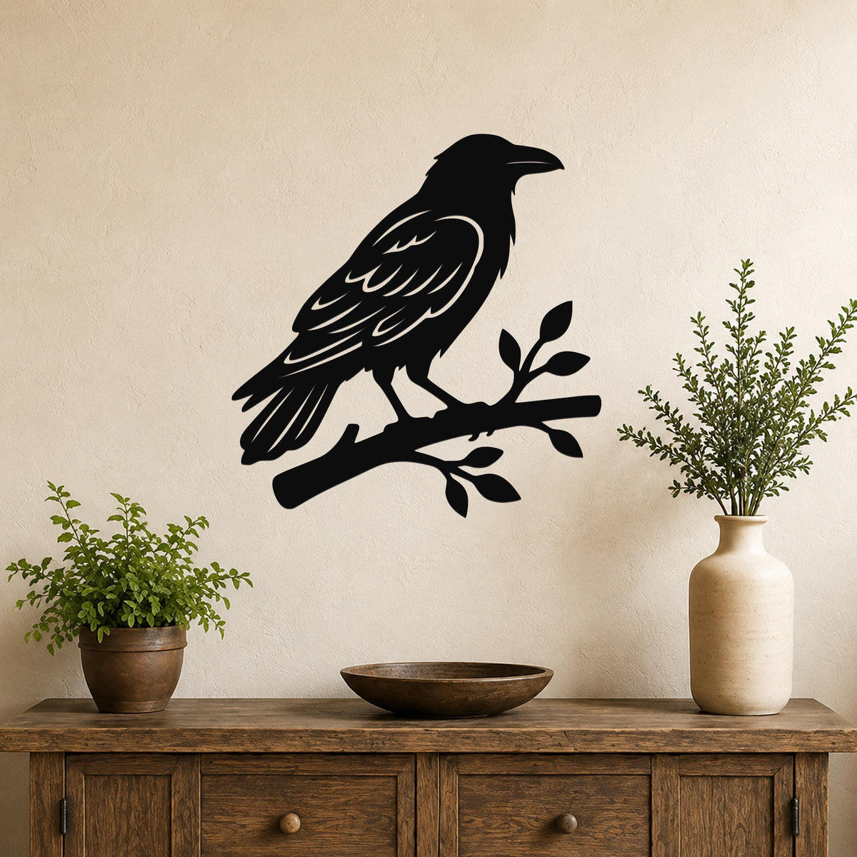 Black metal raven wall art silhouette perched on a branch, mounted above a wooden console table in a living room.