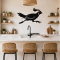 Black metal quail wall art silhouette with motion lines, mounted above a kitchen counter in a modern rustic kitchen.