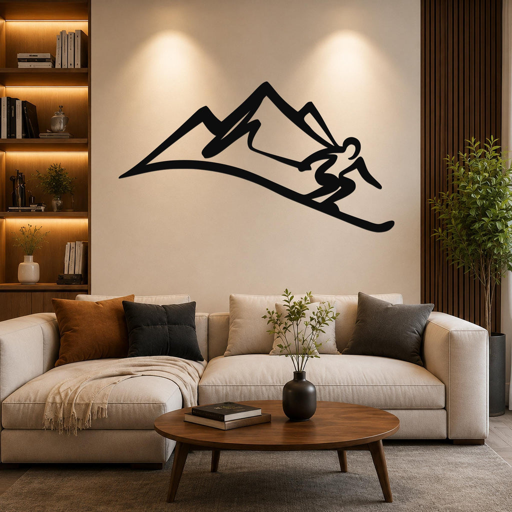 Black metal wall art silhouette of a skier in motion on a mountain slope, mounted above a beige sofa in a living room.
