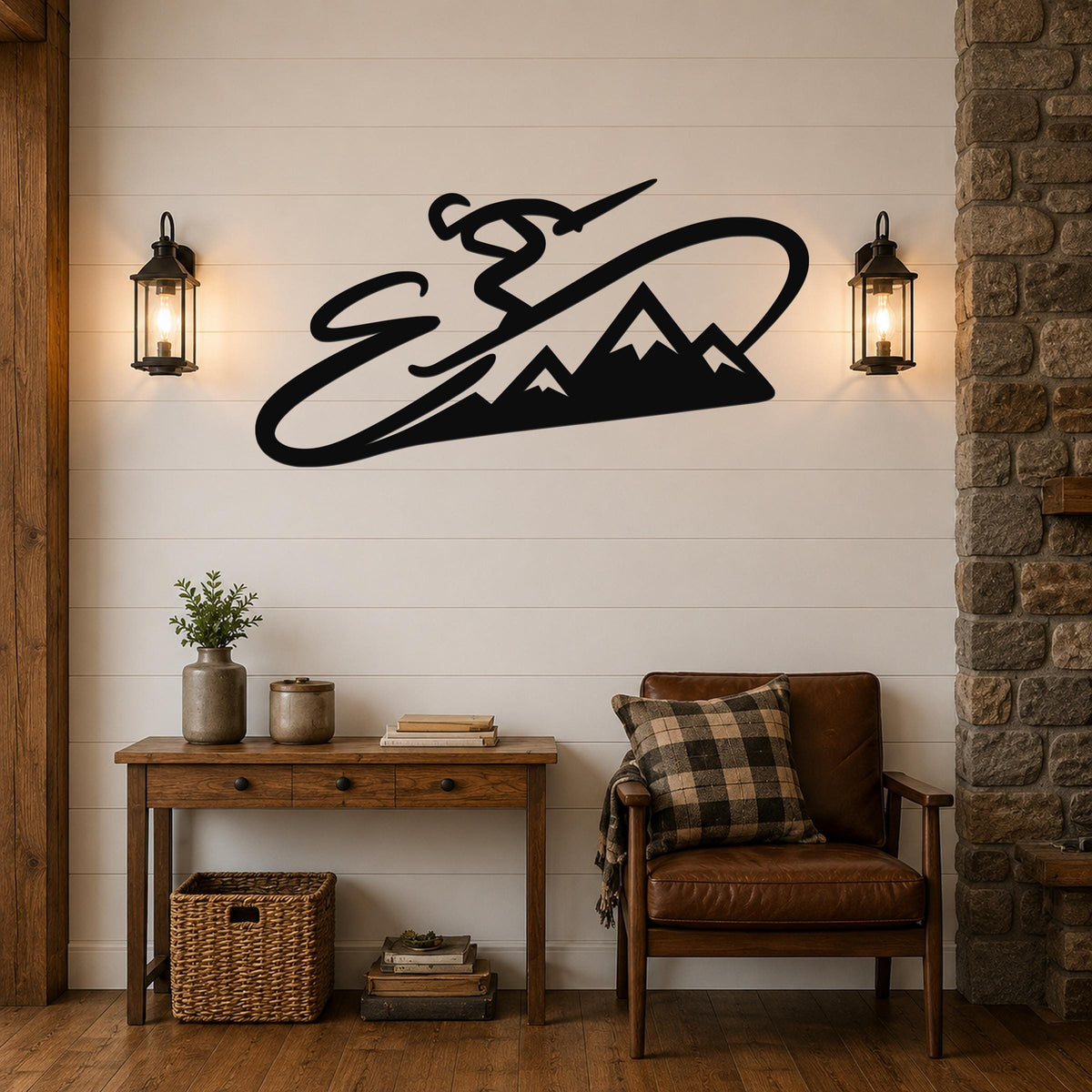 Black metal wall art featuring a skier silhouette and mountain range, mounted on a shiplap wall above a wooden console table in a living room.