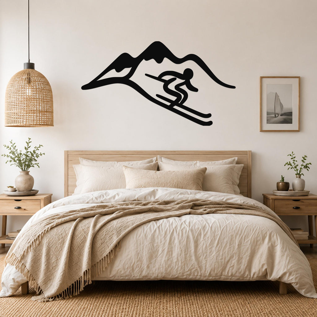 Black metal wall art featuring a skier silhouette in motion against a mountain range, mounted above a wooden bed in a neutral bedroom.