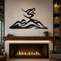 Black metal wall art featuring a skier silhouette above mountain peaks, mounted above a fireplace in a living room.