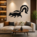 Black metal skunk wall art silhouette with a curved tail, mounted above a beige sofa in a living room.
