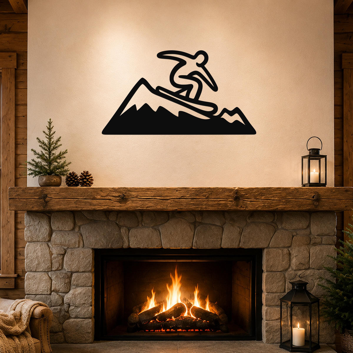 Black metal wall art silhouette of a snowboarder on a mountain, mounted above a stone fireplace in a rustic living room.