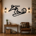 Black metal wall art silhouette of a snowboarder in motion, mounted on a shiplap wall above a wooden console table in a living room.