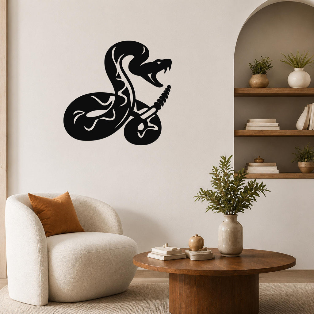 Black metal wall art featuring a coiled snake silhouette with internal cutout patterns, mounted on a living room wall above a white armchair.