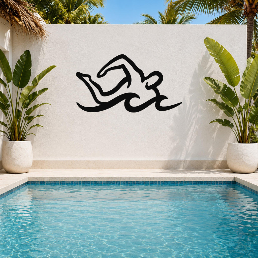 Black metal swimmer wall art with fluid motion cutouts, mounted on a white outdoor wall above a pool, flanked by potted plants.