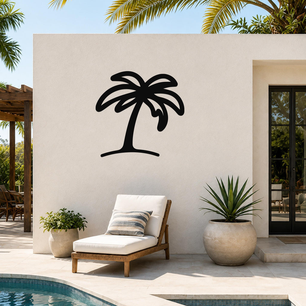 Black metal palm tree wall art with a silhouette design, mounted on an outdoor patio wall above a lounge chair near a pool.