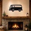 Black metal vintage van wall art with surfboard silhouette, mounted above a stone fireplace in a rustic living room.