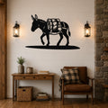 Black metal burro wall art with a backpack silhouette, mounted on a shiplap wall above a wooden console table in a rustic living room.