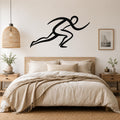 Black metal runner wall art with dynamic motion lines, mounted above a bed in a neutral bedroom.