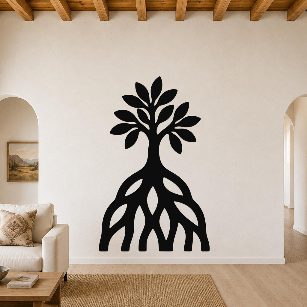 Black metal wall art silhouette of a mangrove tree with exposed roots and leafy canopy, mounted on a living room wall above a sofa.