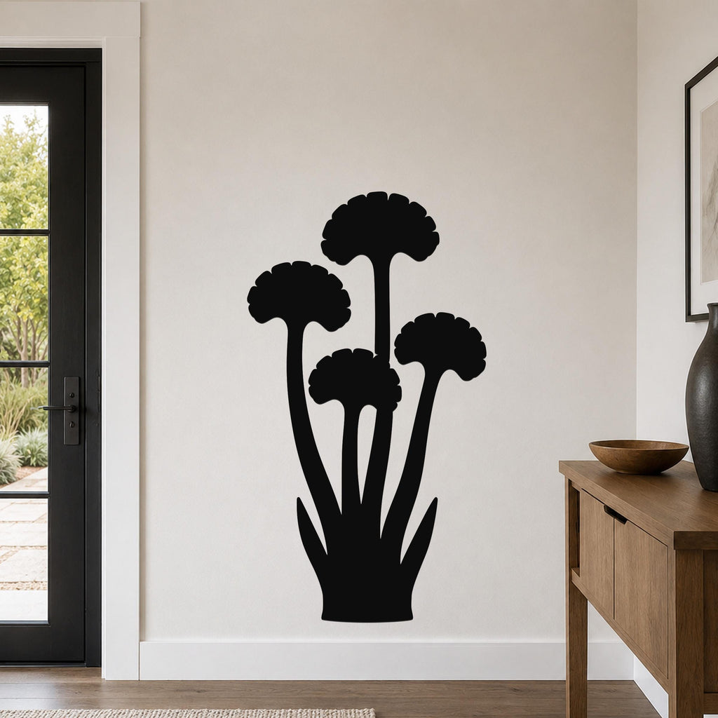 Black metal wall art featuring a ginkgo leaf silhouette with multiple stems and fan-shaped leaves, mounted on a light-colored wall in a modern entryway.