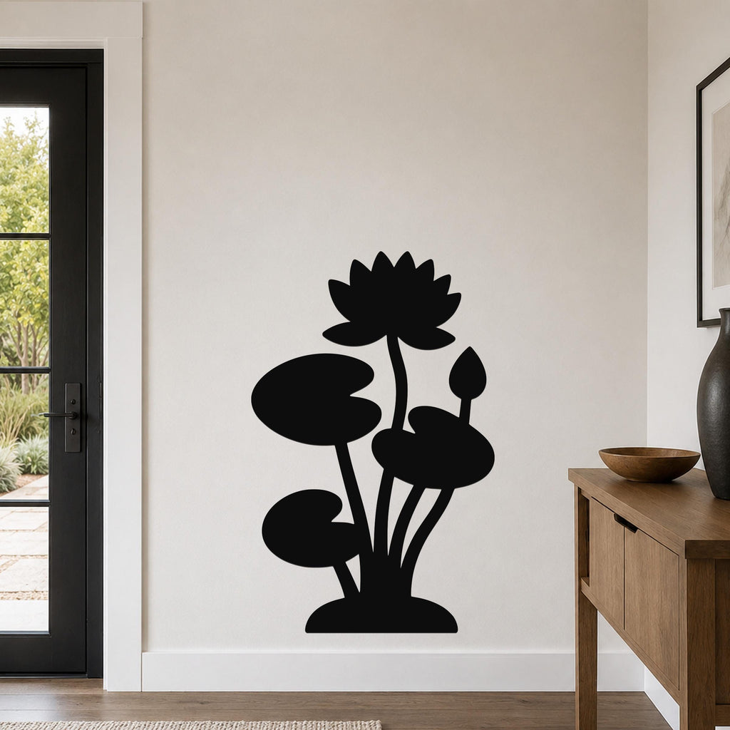 Black metal lotus water lily wall art with a silhouette design of flowers and leaves, mounted on a living room wall above a wooden console table.