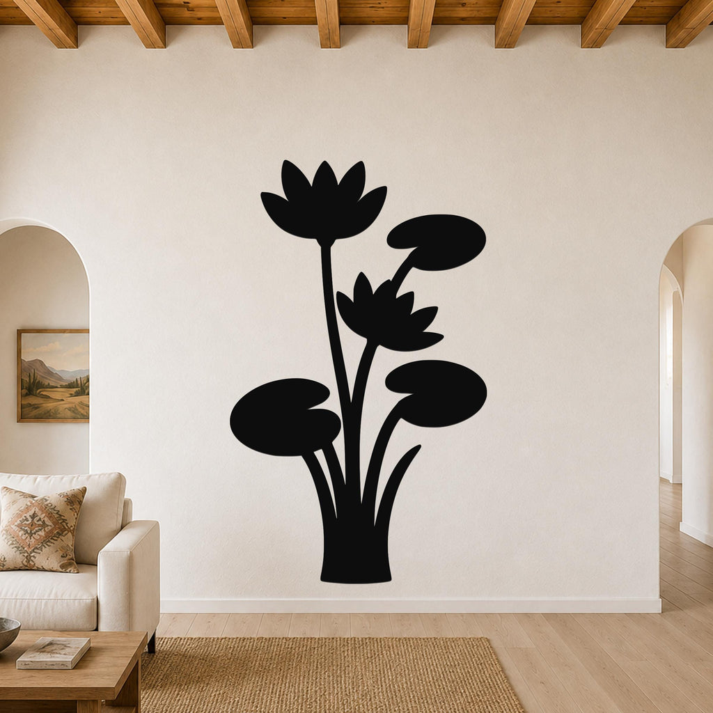 Black metal wall art silhouette of lotus flowers and lily pads, mounted on a living room wall above a sofa.