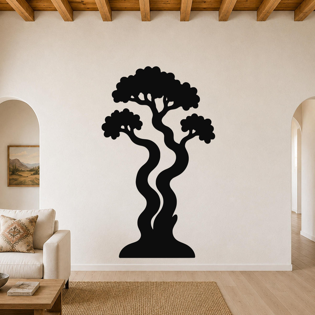 Black metal wall art in a bonsai tree silhouette with wavy trunks and layered canopy, mounted on a living room wall above a sofa.