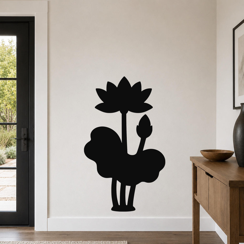 Black metal wall art silhouette of a lotus flower and lily pad, mounted on a living room wall above a wooden console table.
