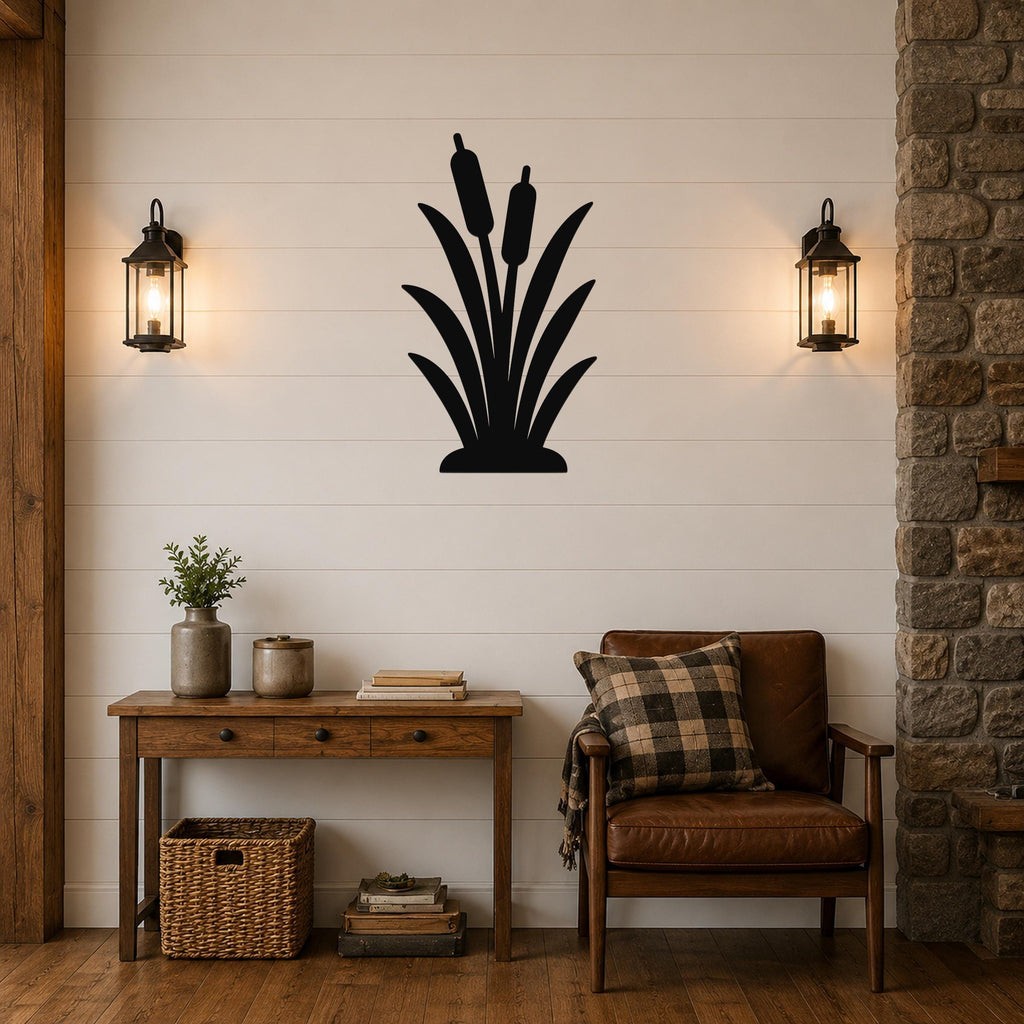 Black metal cattail wall art silhouette mounted on a shiplap wall above a wooden console table in a rustic living room.