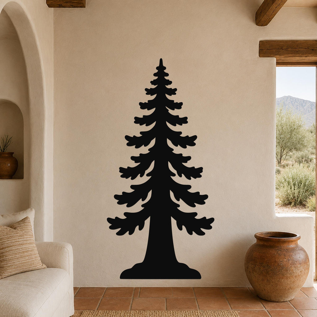 Black metal sequoia tree wall art with layered branch cutouts, mounted on a beige stucco wall in a living room with terracotta flooring and wooden beams.