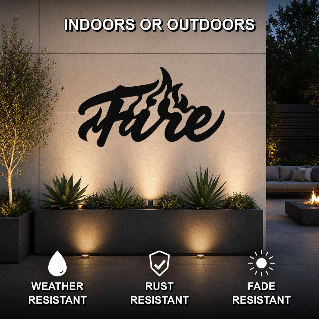 Black metal wall art with the word "Fire" in cursive script and flame cutouts, mounted on an outdoor wall above a planter in a modern patio setting.
