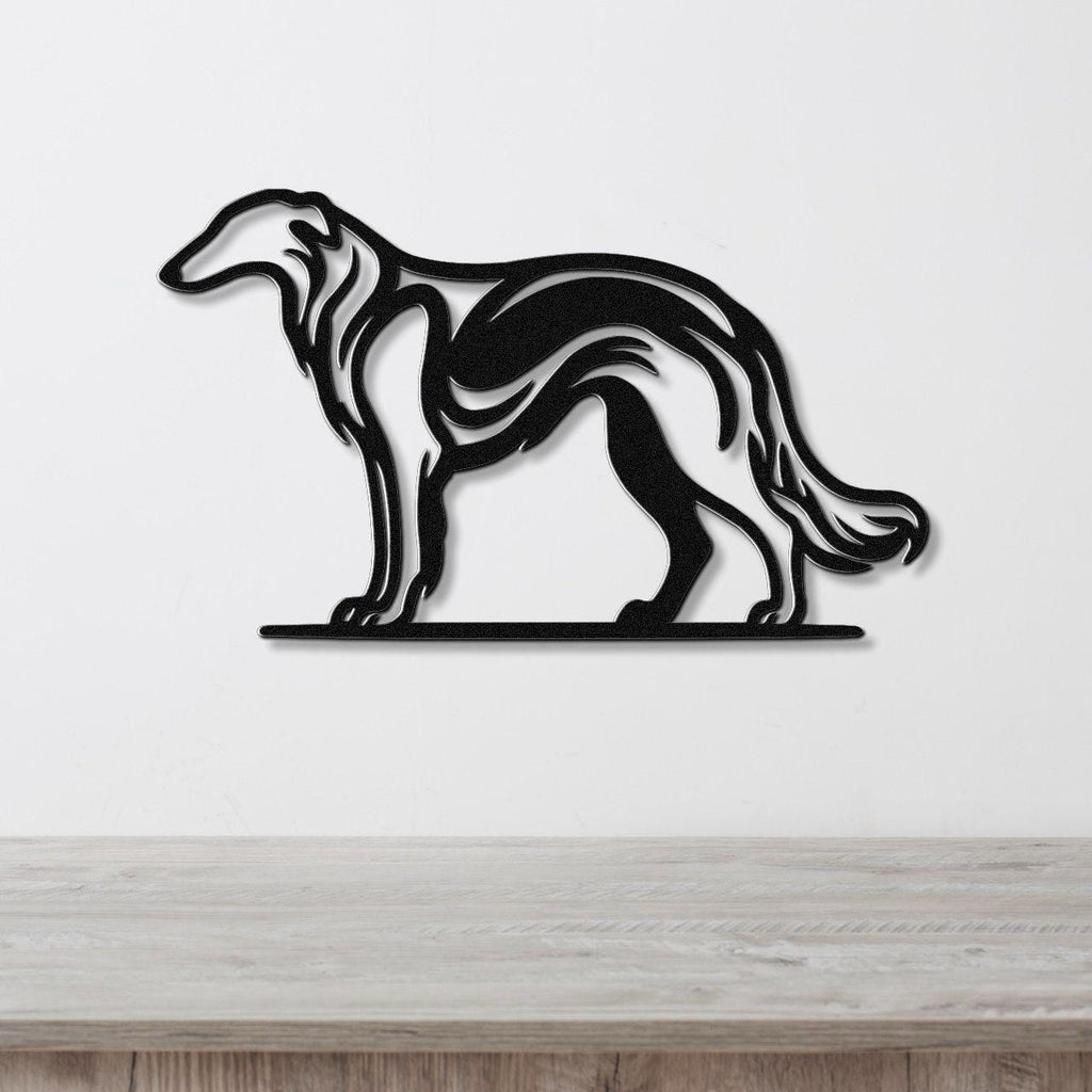 Black metal Borzoi dog wall art with flowing motion-line cutouts, mounted on a white wall above a light wood counter.